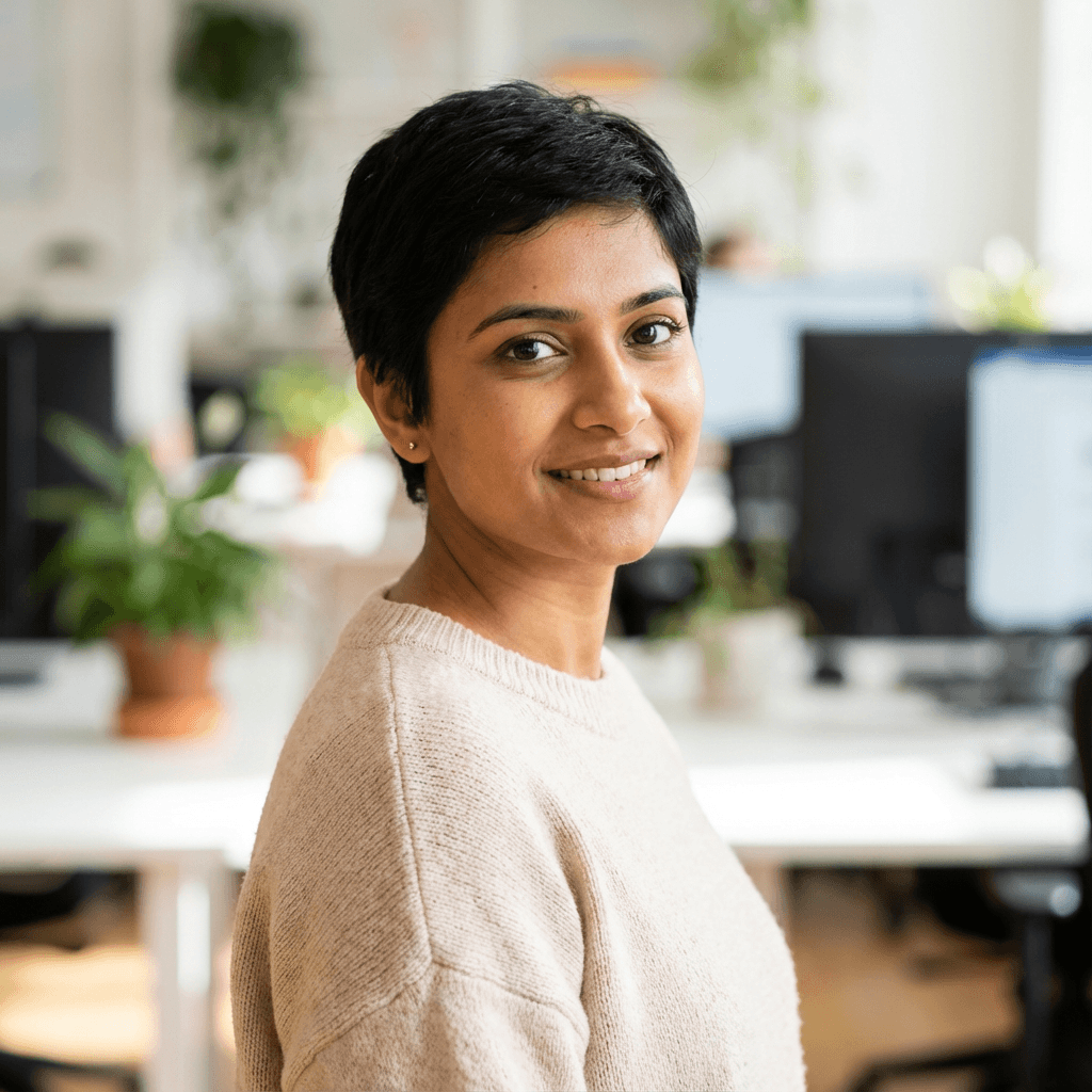 Priya Patel smiling outdoors in a park